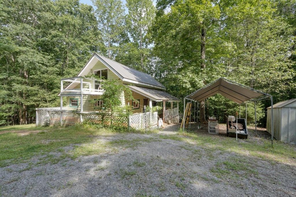 51 Cold Springs Trail Morganton, GA 30560 - Photo 5 of 40 a front view of a house with garden