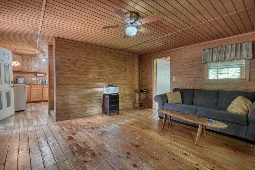 51 Cold Springs Trail Morganton, GA 30560 - Photo 7 of 40 a outdoor space with wooden floor and a ceiling fan