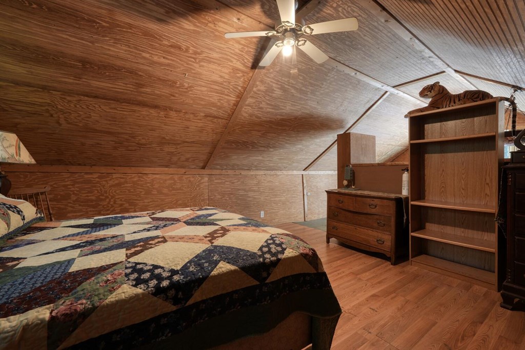 51 Cold Springs Trail Morganton, GA 30560 - Photo 9 of 40 a bedroom with a bed and wooden floor