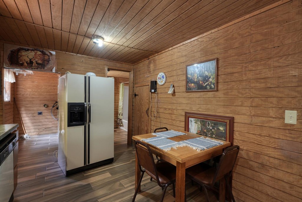 51 Cold Springs Trail Morganton, GA 30560 - Photo 10 of 40 a kitchen with a table and refrigerator