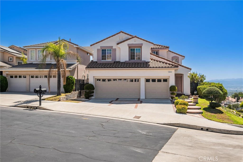 19852 Owl Creek Way Porter Ranch, CA 91326 - Photo 1 of 1 a front view of a house with a yard