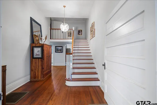 a bathroom with a sink mirror toilet and bathtub