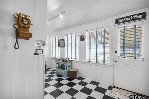 a view of a hallway with windows