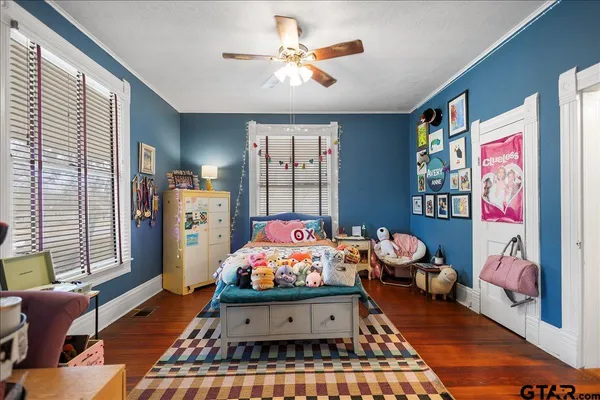 a bedroom with a bed and a table in it