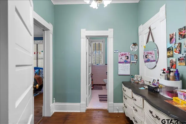a living room with furniture a window and a flat screen tv