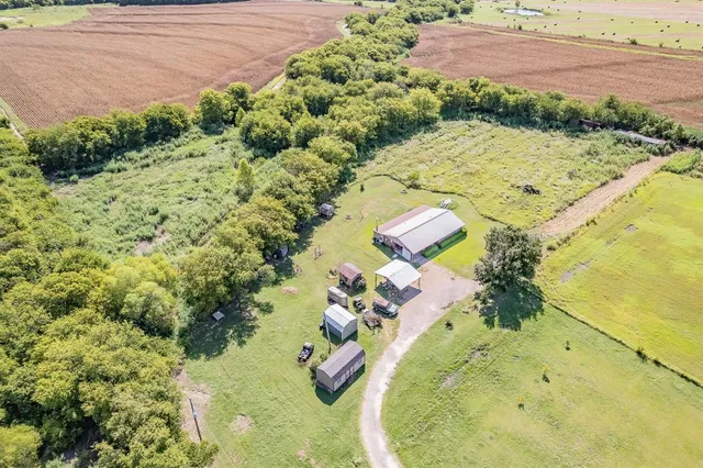 a view of a swimming pool with a yard