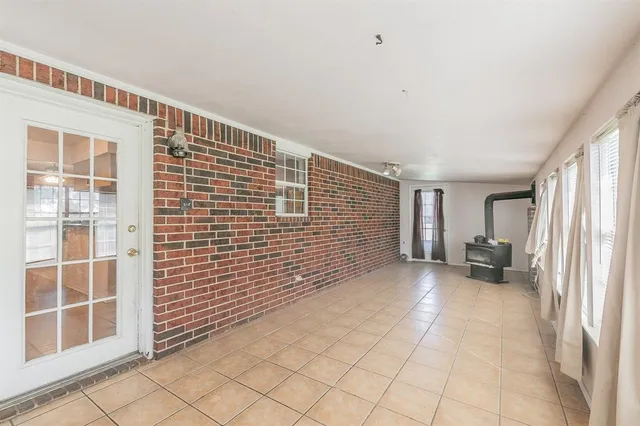 a view of an empty room with windows