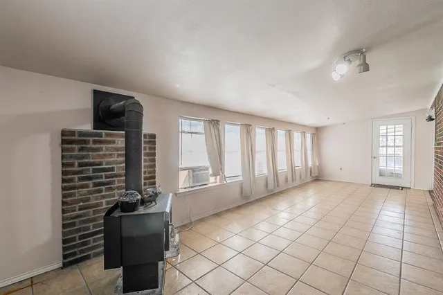 a view of empty room with windows