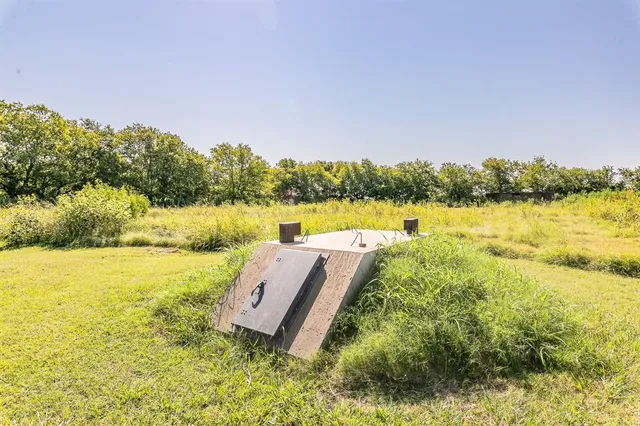 a view of a lake with houses in the back