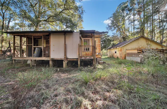 a view of house with back yard