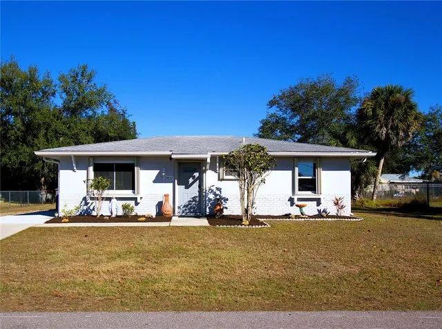 a front view of a house with outdoor seating