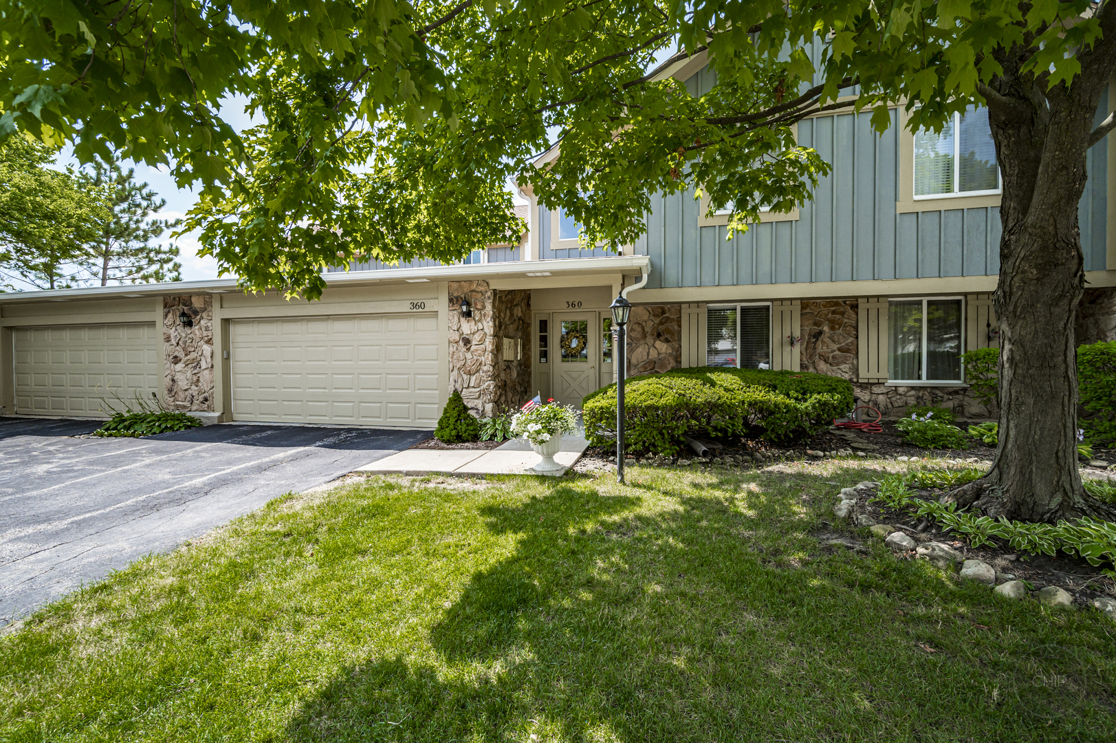360 Springlake Lane, Unit B Aurora, IL 60504 - Photo 1 of 26 front view of a house with a yard