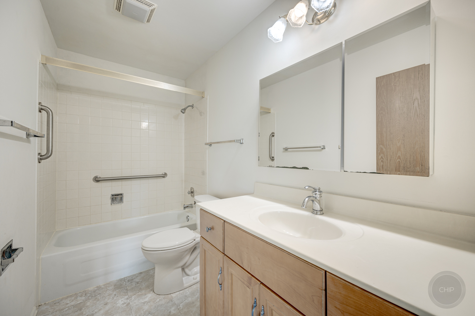 360 Springlake Lane, Unit B Aurora, IL 60504 - Photo 13 of 26 a bathroom with a sink a toilet and shower