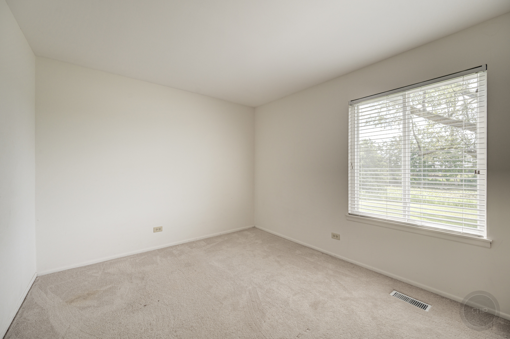 360 Springlake Lane, Unit B Aurora, IL 60504 - Photo 16 of 26 a view of an empty room with a window