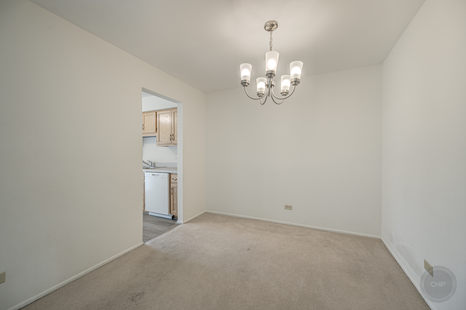 360 Springlake Lane, Unit B Aurora, IL 60504 - Photo 6 of 26 a view of empty room with chandelier