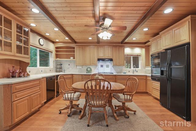 1429 Chinquapin Drive South Lake Tahoe, CA 96150 - Photo 11 of 37 a kitchen with stainless steel appliances granite countertop a dining table chairs refrigerator and sink