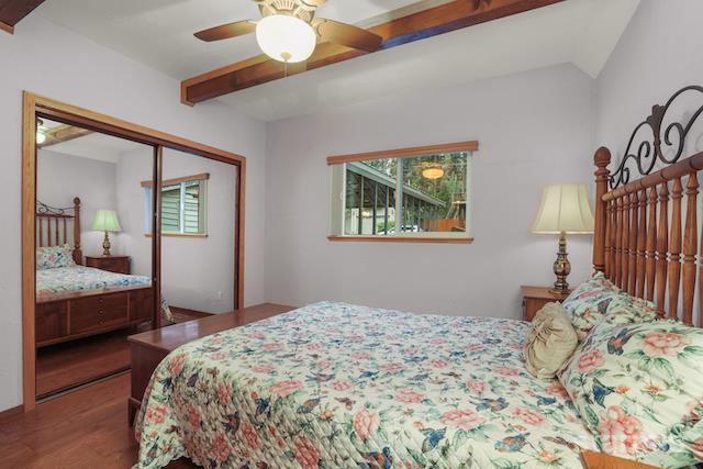1429 Chinquapin Drive South Lake Tahoe, CA 96150 - Photo 20 of 37 a bedroom with a large bed and a chandelier