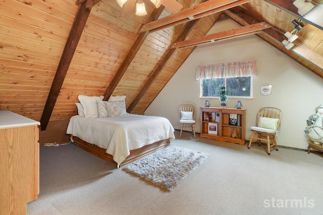 1429 Chinquapin Drive South Lake Tahoe, CA 96150 - Photo 22 of 37 a bedroom with a bed and a table