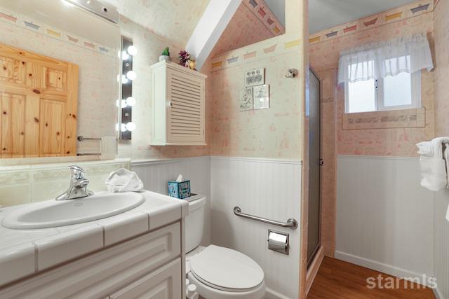 1429 Chinquapin Drive South Lake Tahoe, CA 96150 - Photo 26 of 37 a bathroom with a sink a toilet and shower
