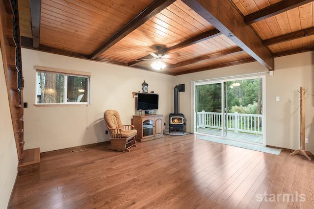 1429 Chinquapin Drive South Lake Tahoe, CA 96150 - Photo 8 of 37 a living room with furniture floor to ceiling window and wooden floor