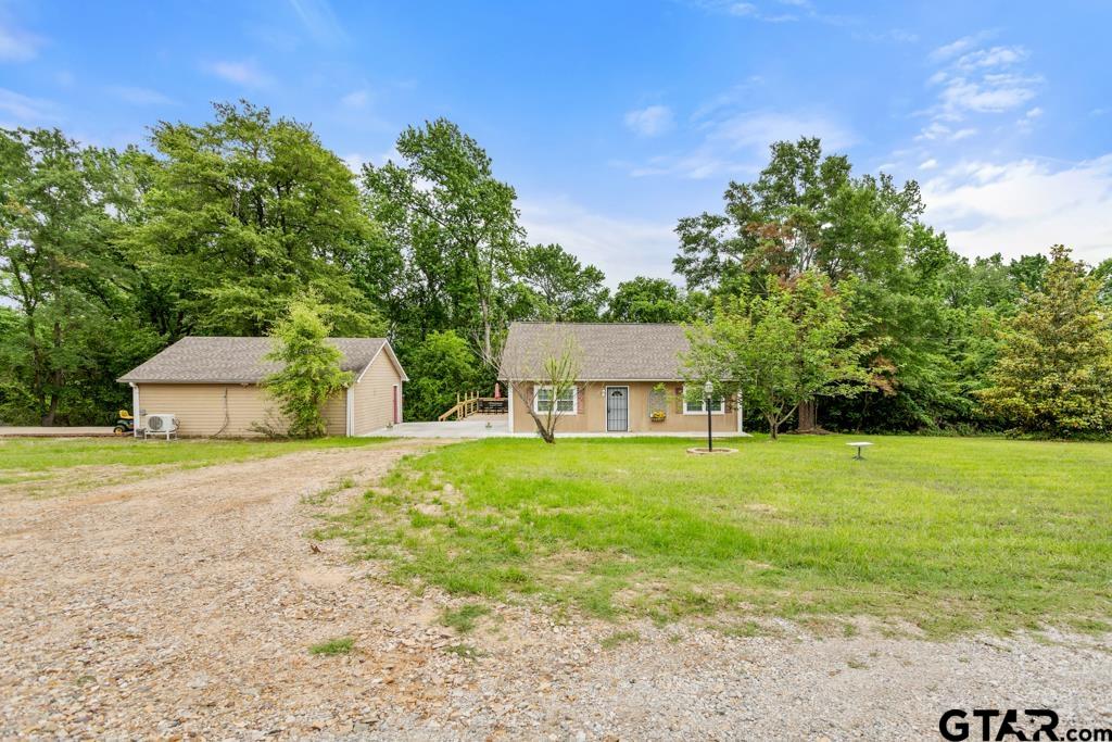 448 North Hill Road Tyler, TX 75706 - Photo 2 of 30 a house with trees in front of it