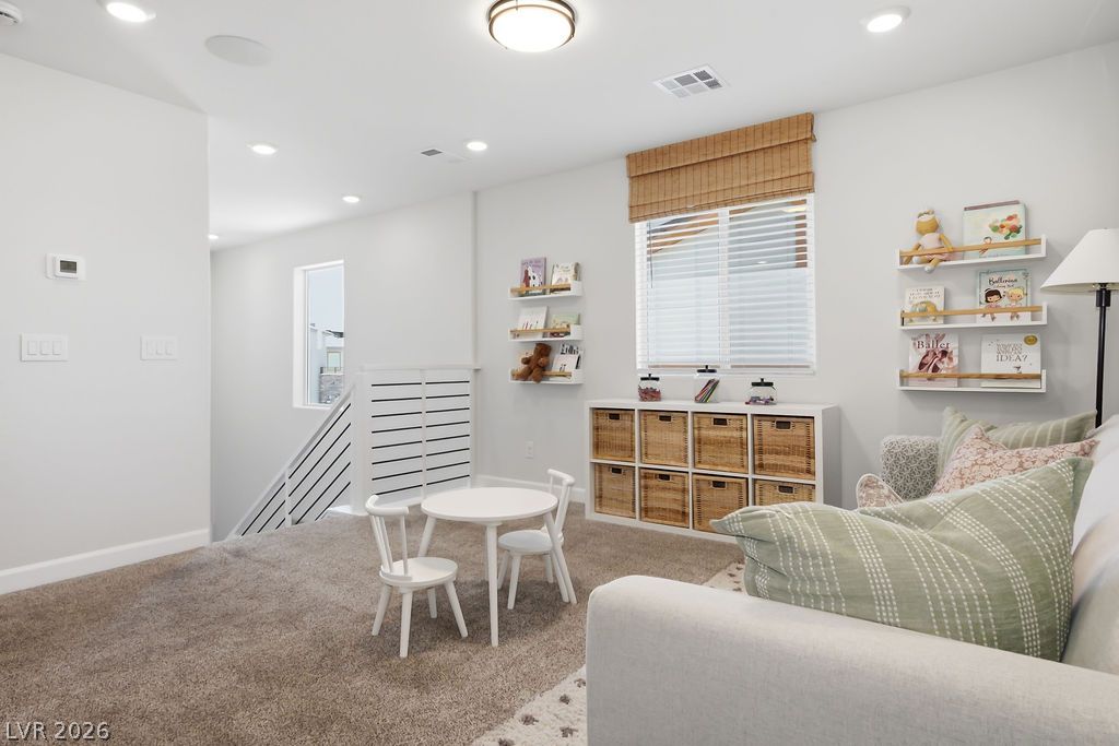 913 Cadence View Way Henderson, NV 89011 - Photo 24 of 46 A well-lit, cozy space offering comfort and function with plush carpeting and bright recessed lighting.