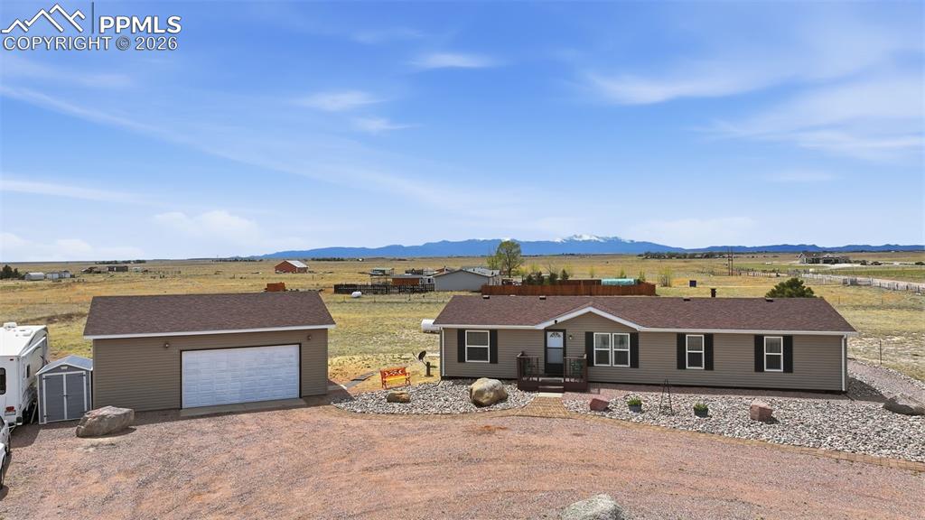 20985 McDaniels Road Calhan, CO 80808 - Photo 2 of 41 an aerial view of a house with a terrace