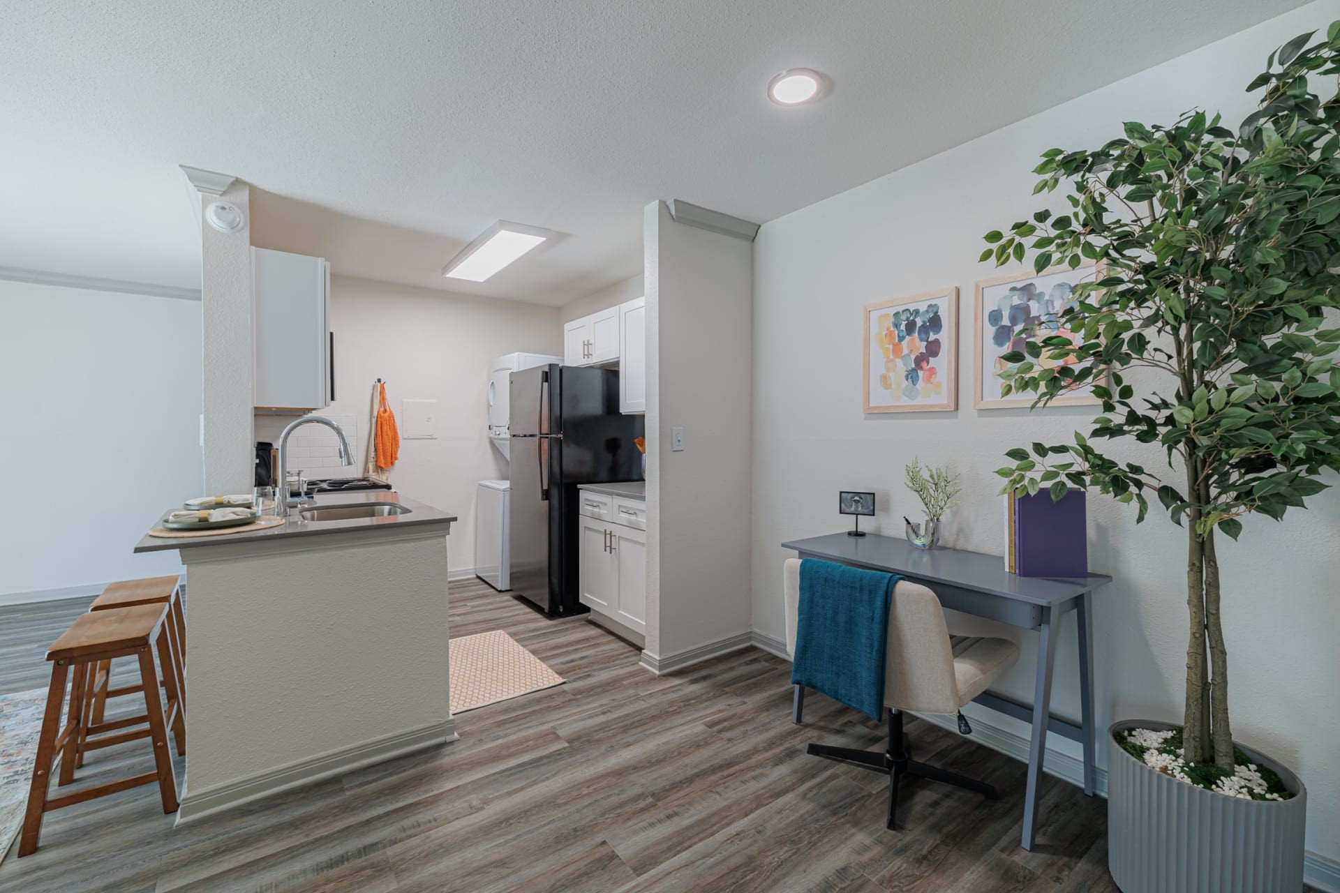 200 Hollow Tree Lane, Unit 3062 Houston, TX 77090 - Photo 10 of 16 a kitchen with a table and chairs in it