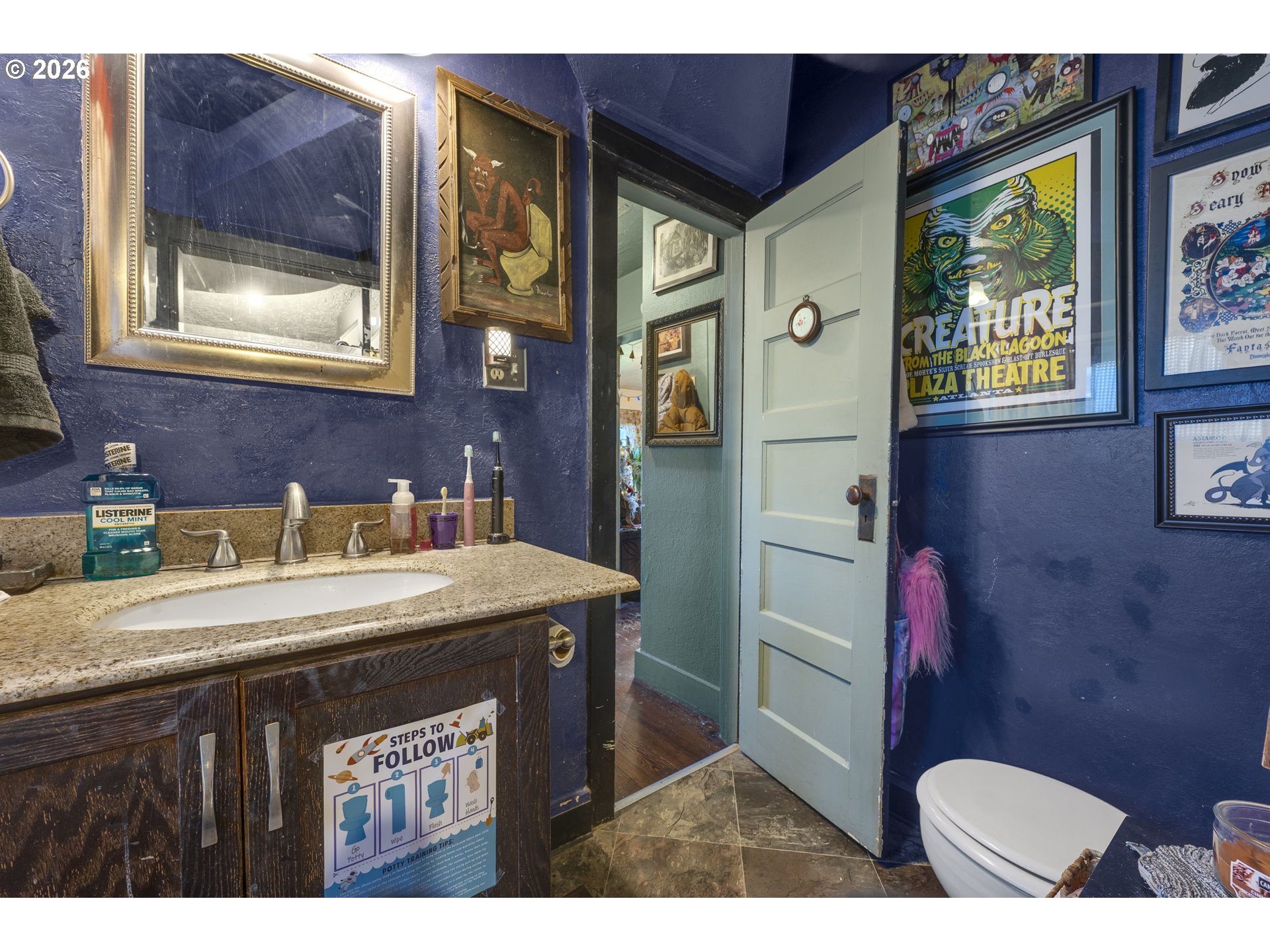 1601 Southeast 130th Avenue Portland, OR 97233 - Photo 13 of 35 a bathroom with a sink a vanity and a mirror