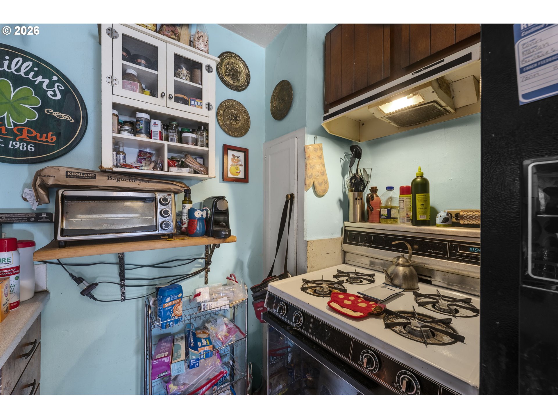 1601 Southeast 130th Avenue Portland, OR 97233 - Photo 17 of 35 a kitchen view of a stove and a refrigerator
