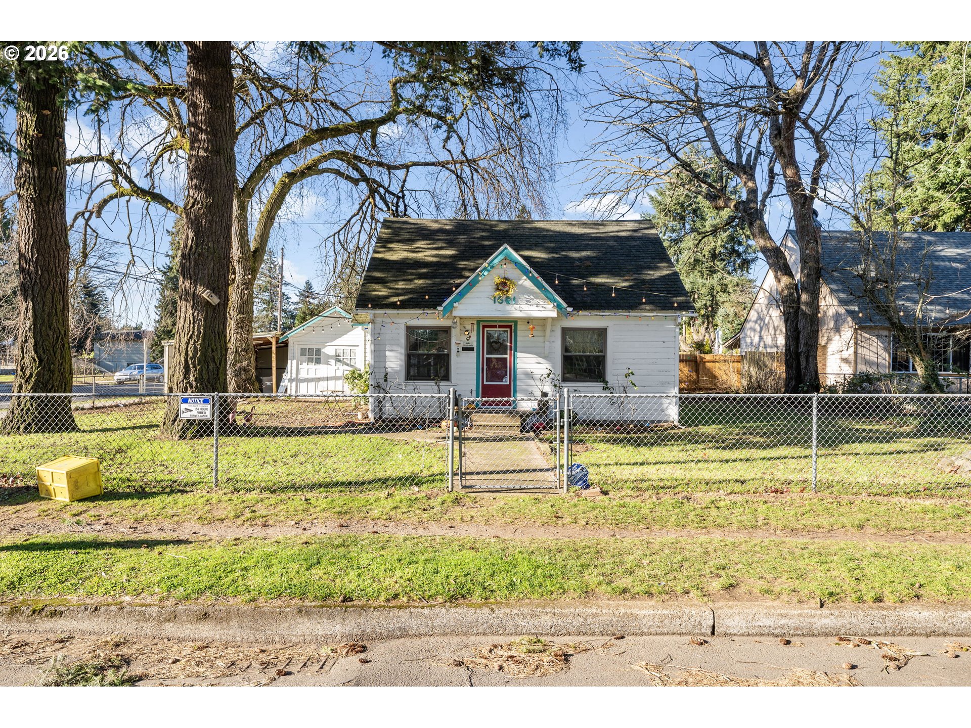 1601 Southeast 130th Avenue Portland, OR 97233 - Photo 3 of 35 a front view of a house with a yard