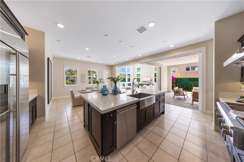 125 Character Irvine, CA 92618 - Photo 19 of 74 a large kitchen with stainless steel appliances a sink stove and cabinets