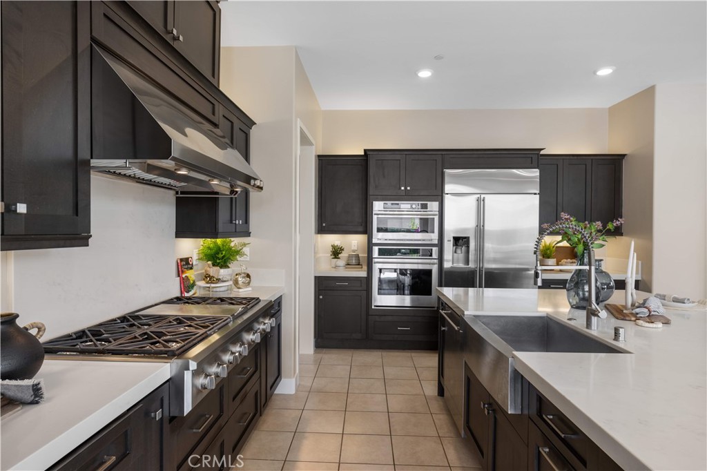 125 Character Irvine, CA 92618 - Photo 20 of 74 a kitchen with stainless steel appliances granite countertop a sink stove and refrigerator