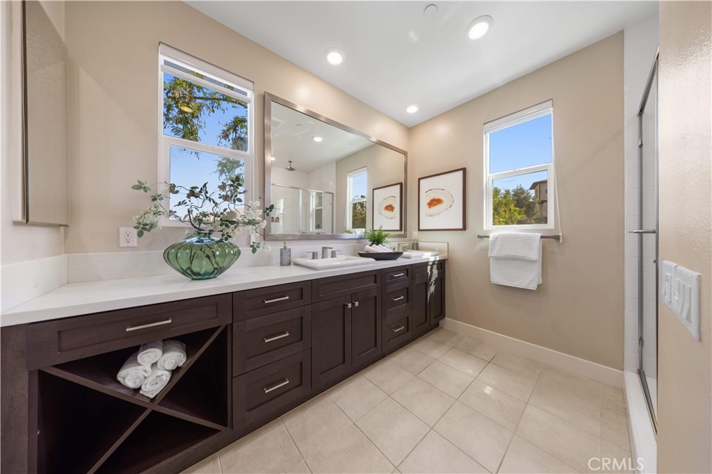 125 Character Irvine, CA 92618 - Photo 26 of 74 a spacious bathroom with a sink double vanity and a mirror