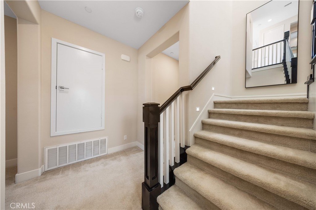 125 Character Irvine, CA 92618 - Photo 32 of 74 a view of staircase with white walls and a window