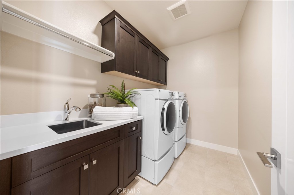125 Character Irvine, CA 92618 - Photo 34 of 74 a utility room with sink dryer and washer
