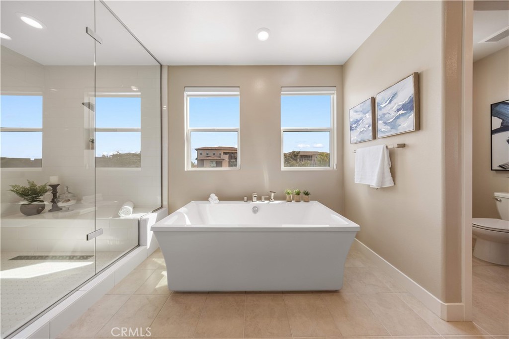 125 Character Irvine, CA 92618 - Photo 42 of 74 a spacious bathroom with a tub sink and mirror