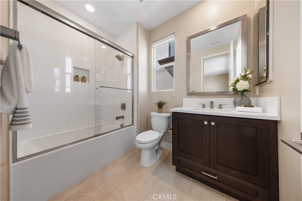 125 Character Irvine, CA 92618 - Photo 50 of 74 a bathroom with a double vanity sink toilet mirror and shower