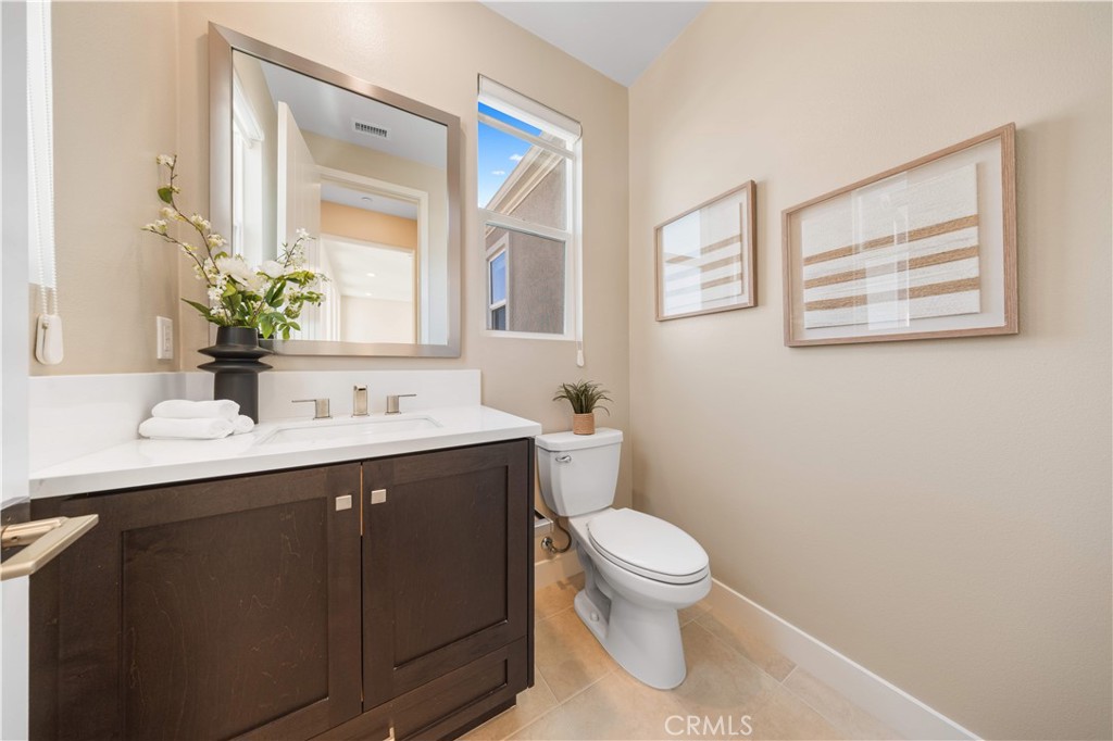 125 Character Irvine, CA 92618 - Photo 55 of 74 a bathroom with a toilet sink and mirror