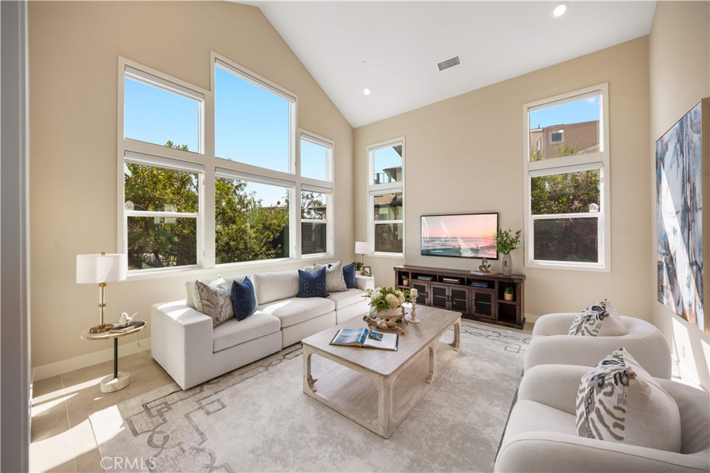 125 Character Irvine, CA 92618 - Photo 6 of 74 a living room with furniture tv and a large window