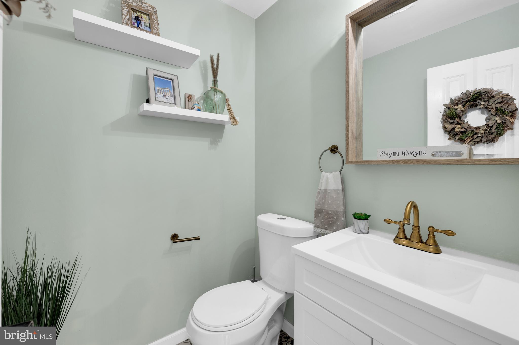 1548 Huron Drive Sinking Spring, PA 19608 - Photo 13 of 32 a bathroom with a toilet a sink and mirror