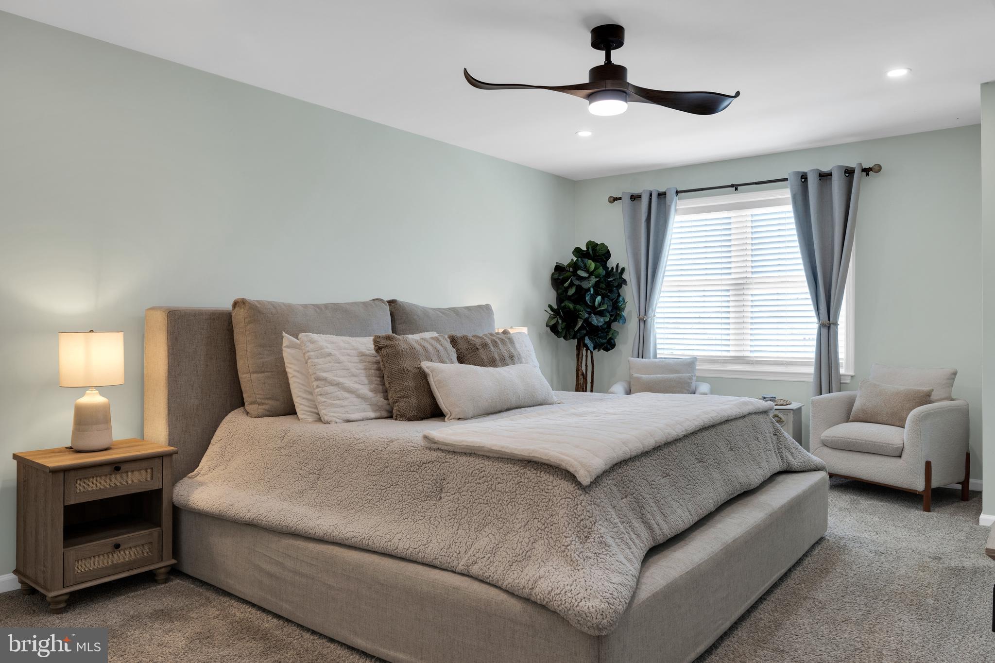1548 Huron Drive Sinking Spring, PA 19608 - Photo 15 of 32 a bedroom with a bed and a ceiling fan