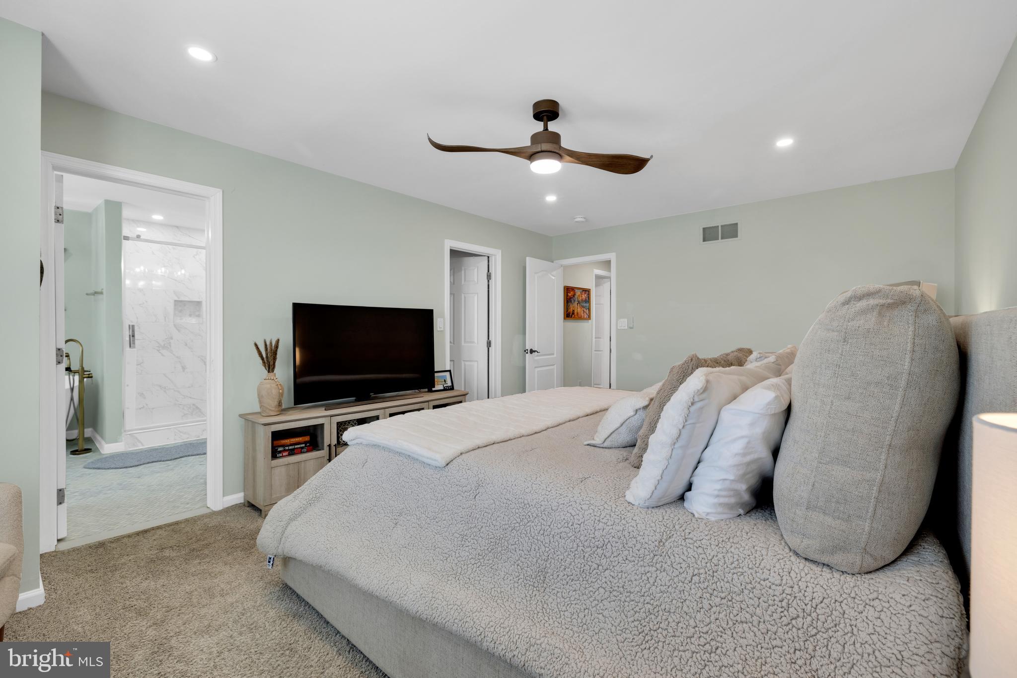 1548 Huron Drive Sinking Spring, PA 19608 - Photo 16 of 32 a bedroom with a bed and a flat screen tv