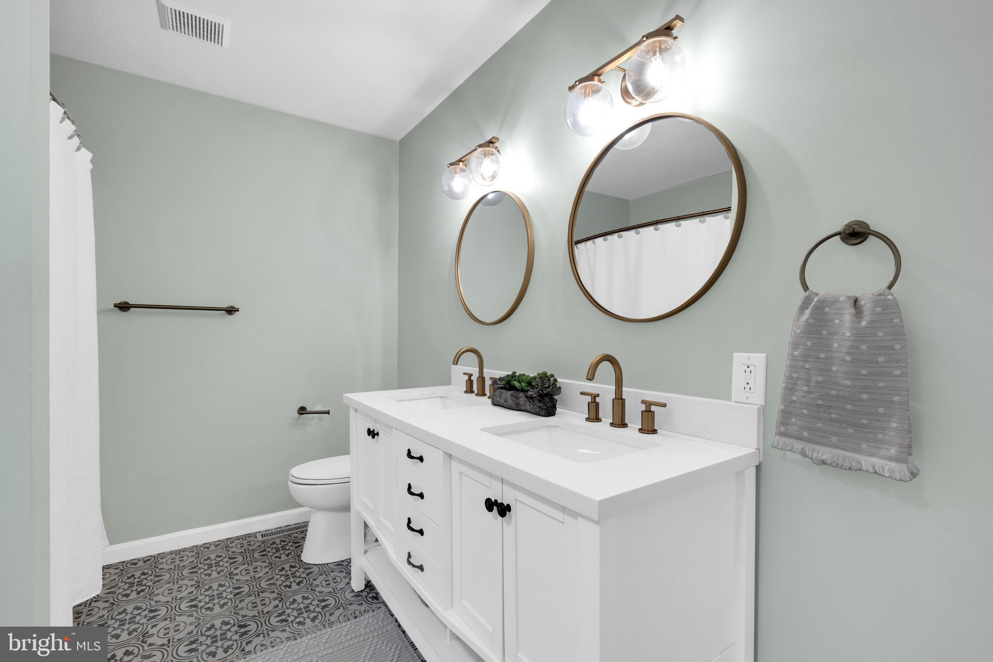 1548 Huron Drive Sinking Spring, PA 19608 - Photo 18 of 32 a bathroom with a sink and a mirror