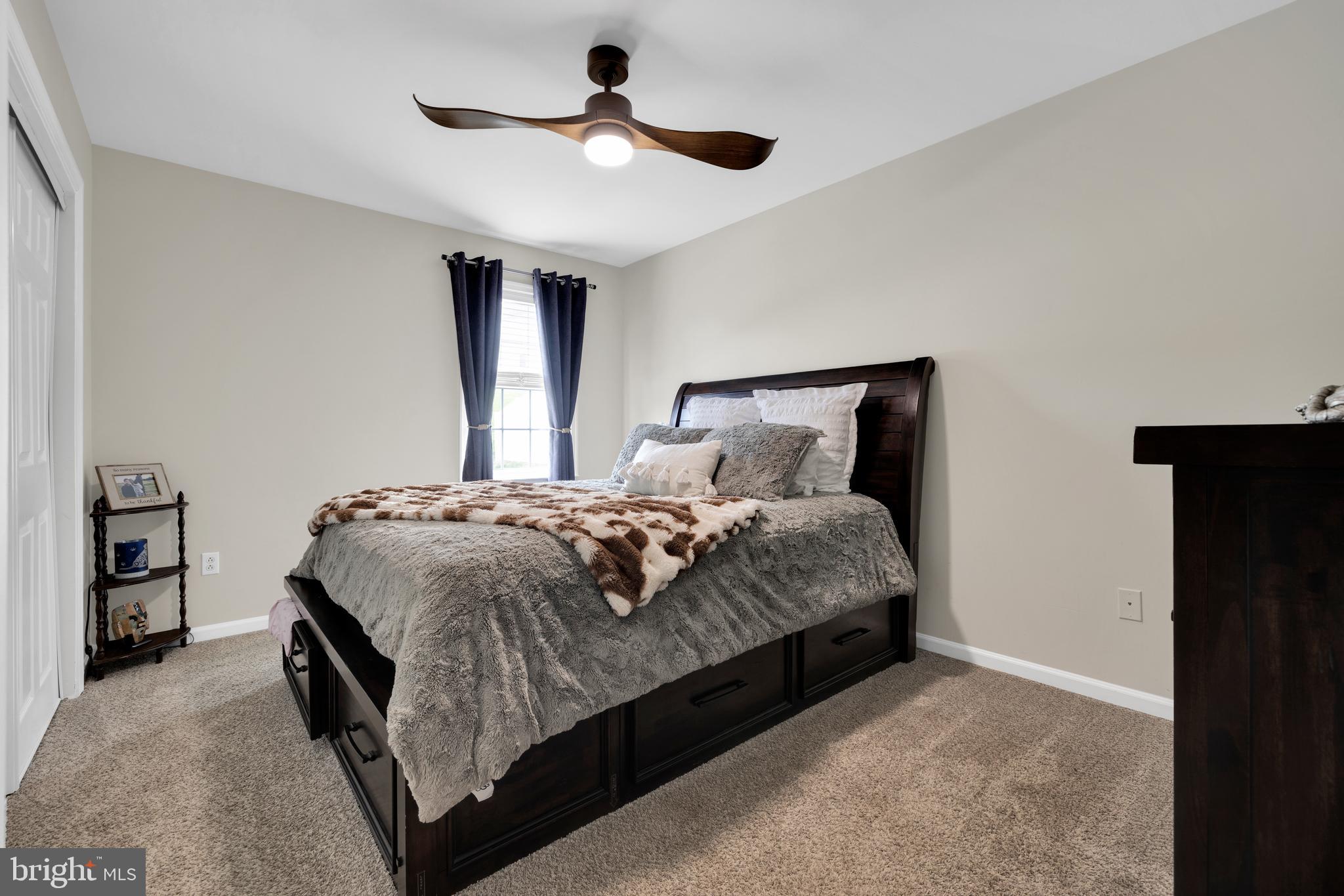 1548 Huron Drive Sinking Spring, PA 19608 - Photo 22 of 32 a bedroom with a bed and a chandelier