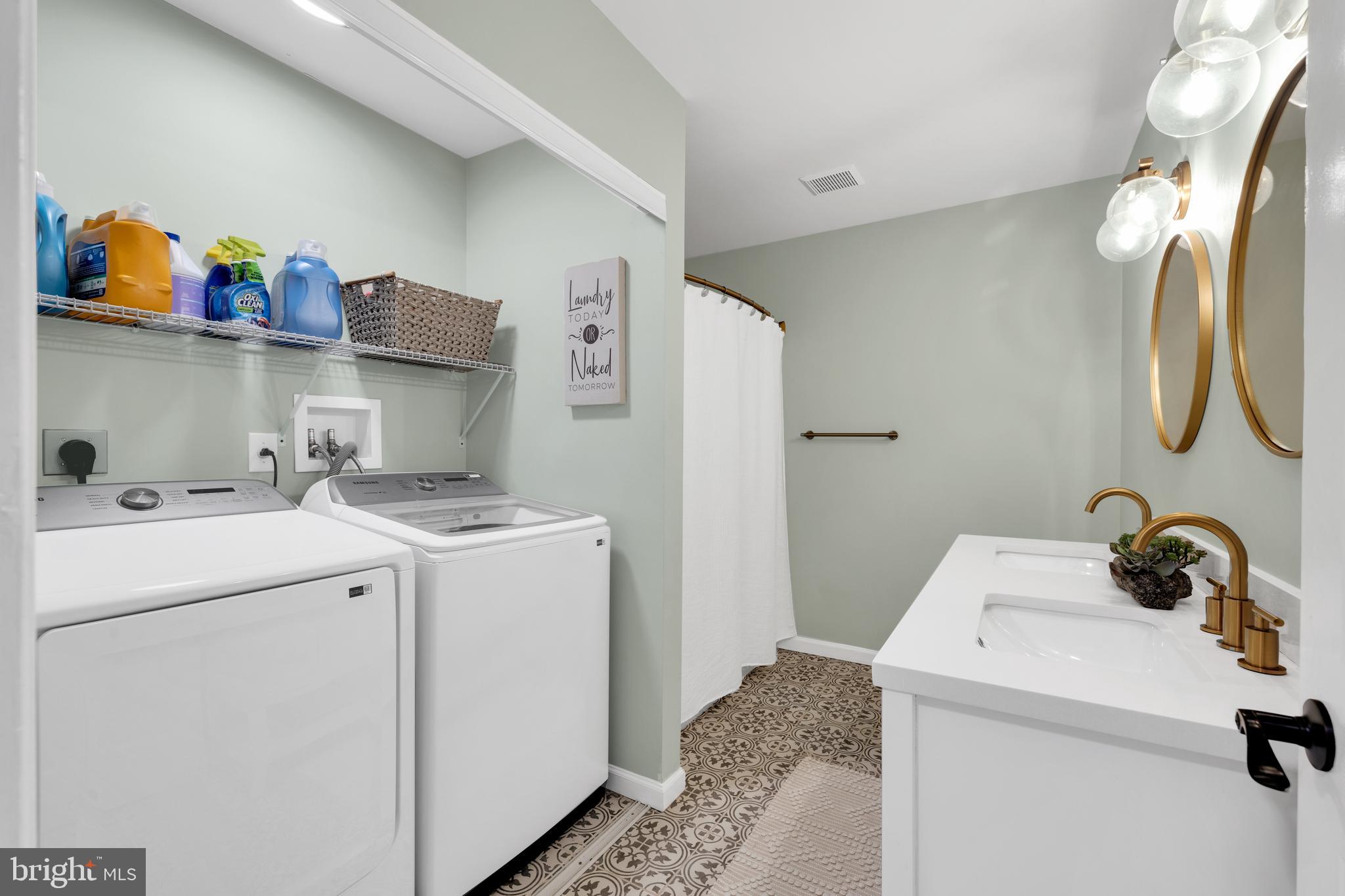 1548 Huron Drive Sinking Spring, PA 19608 - Photo 25 of 32 a utility room with dryer and washer