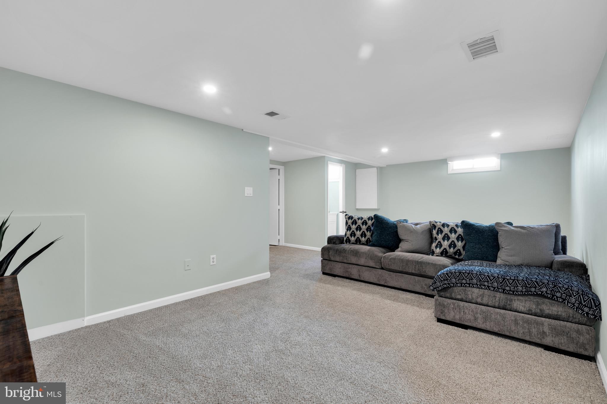 1548 Huron Drive Sinking Spring, PA 19608 - Photo 26 of 32 a living room with a couch and a rug