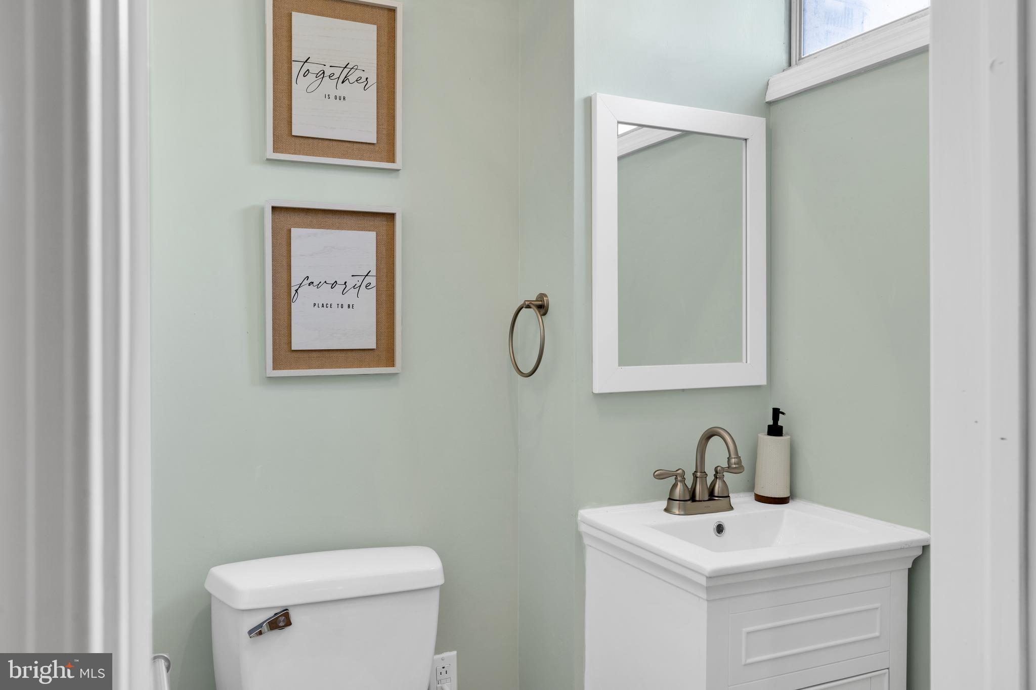 1548 Huron Drive Sinking Spring, PA 19608 - Photo 28 of 32 a bathroom with a toilet sink and mirror