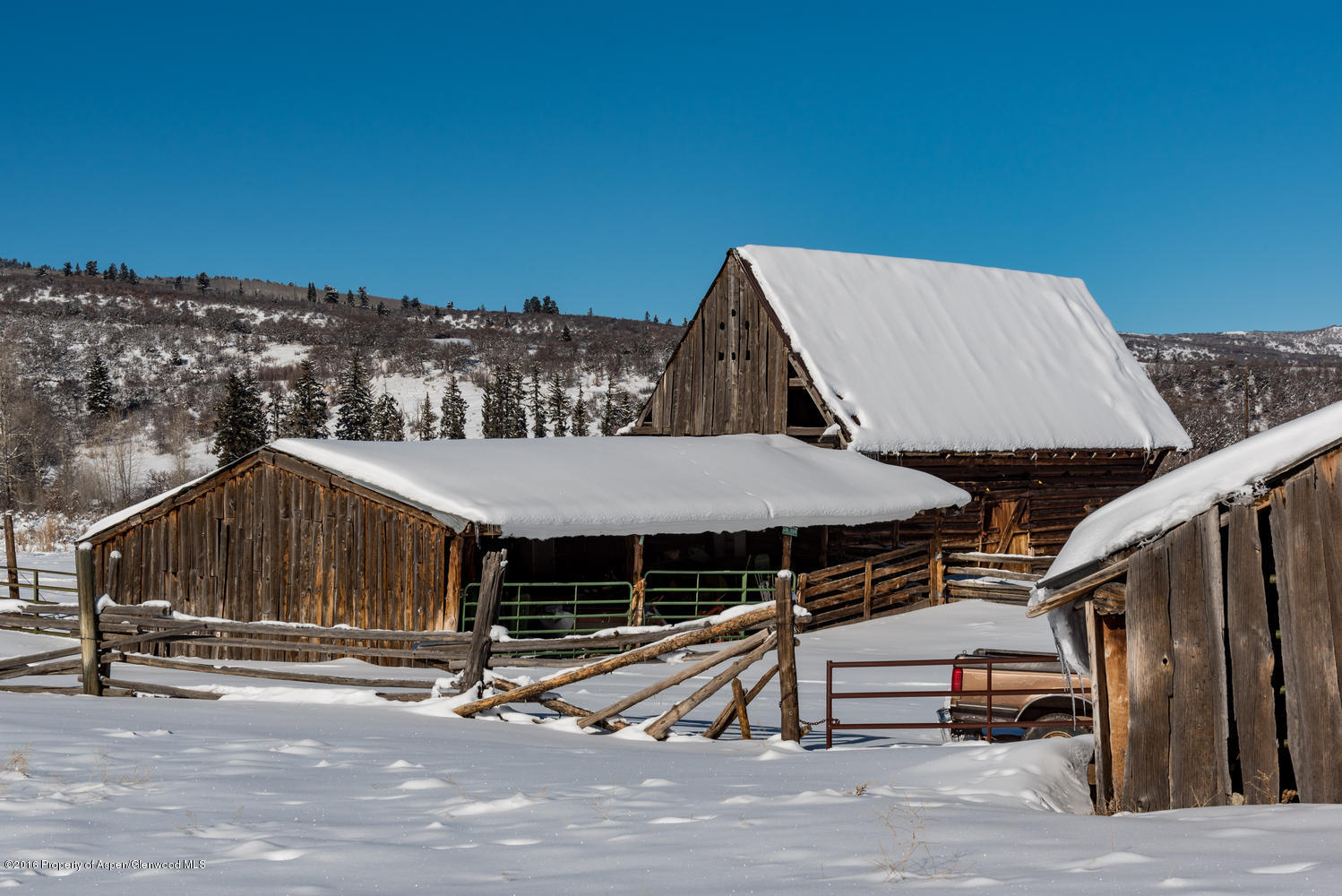 4516 Capitol Creek Road Snowmass, CO 81654 - Photo 16 of 59 a view of a house with roof deck and flat screen tv