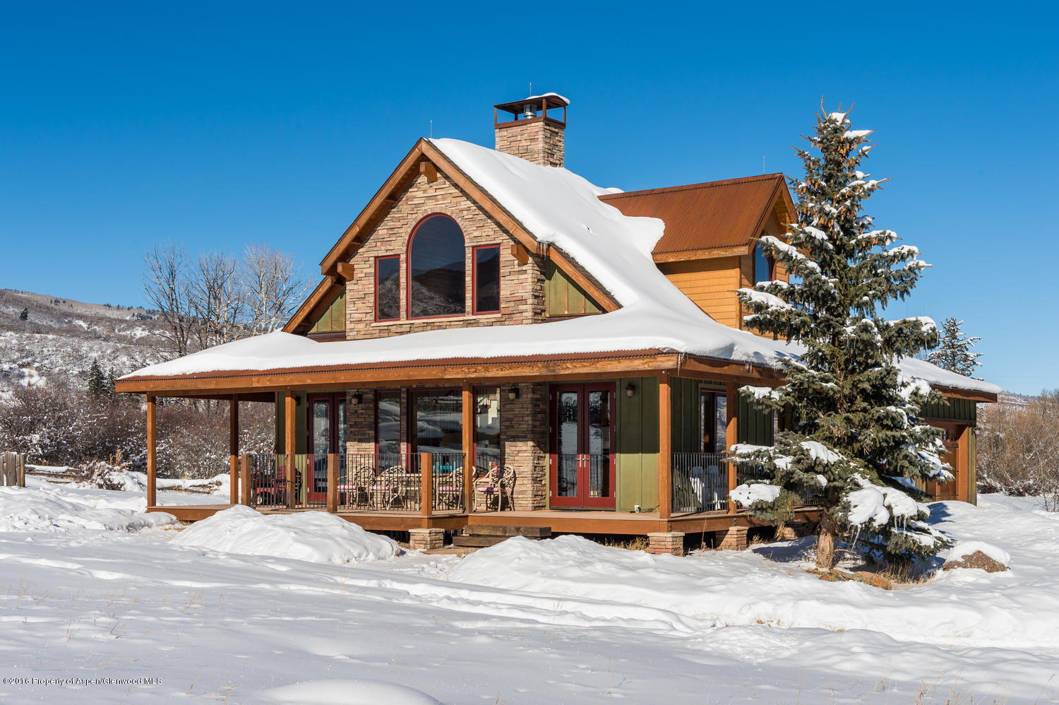 4516 Capitol Creek Road Snowmass, CO 81654 - Photo 5 of 59 a view of a house with a yard